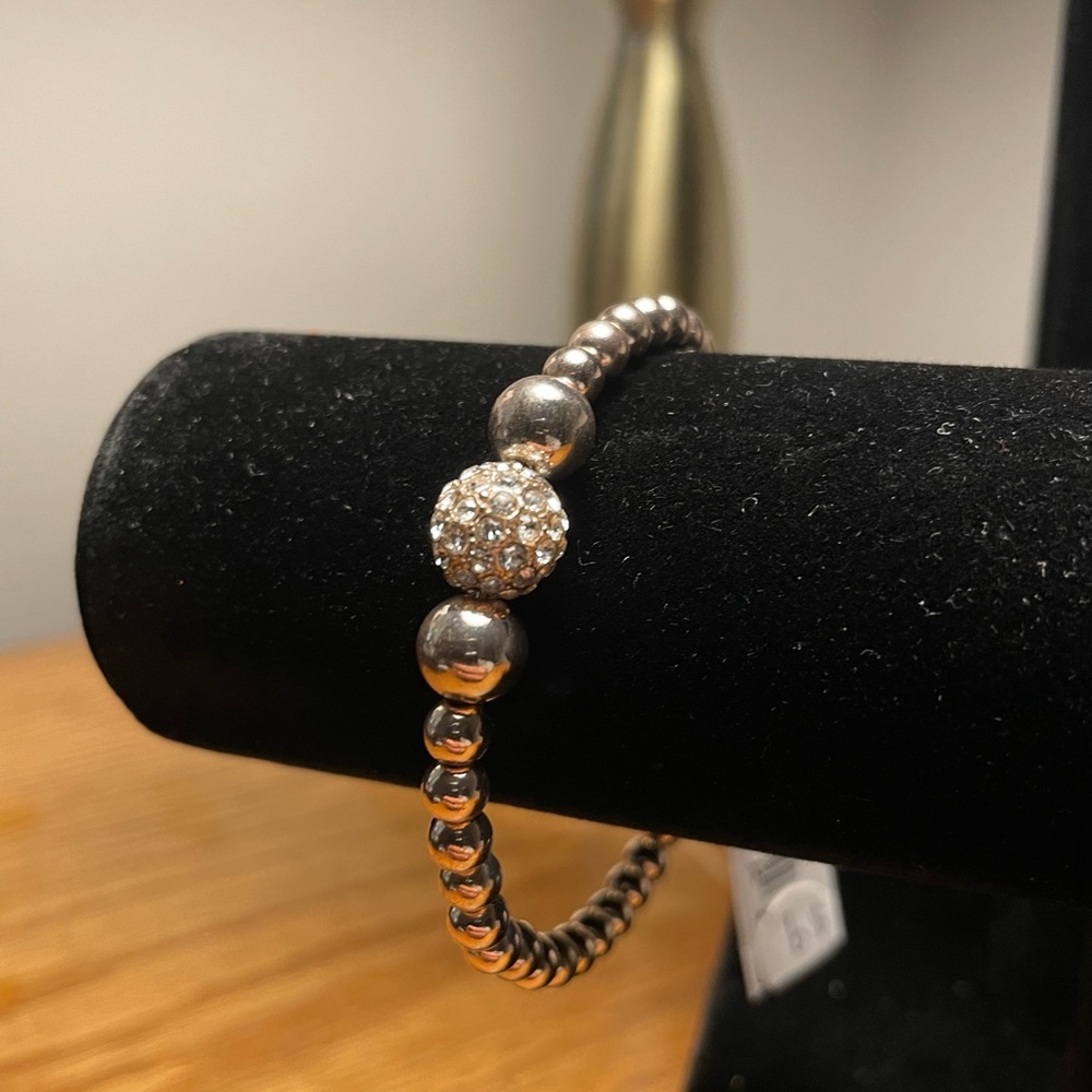 Very light rose gold magnetic clip little spheres bracelet.